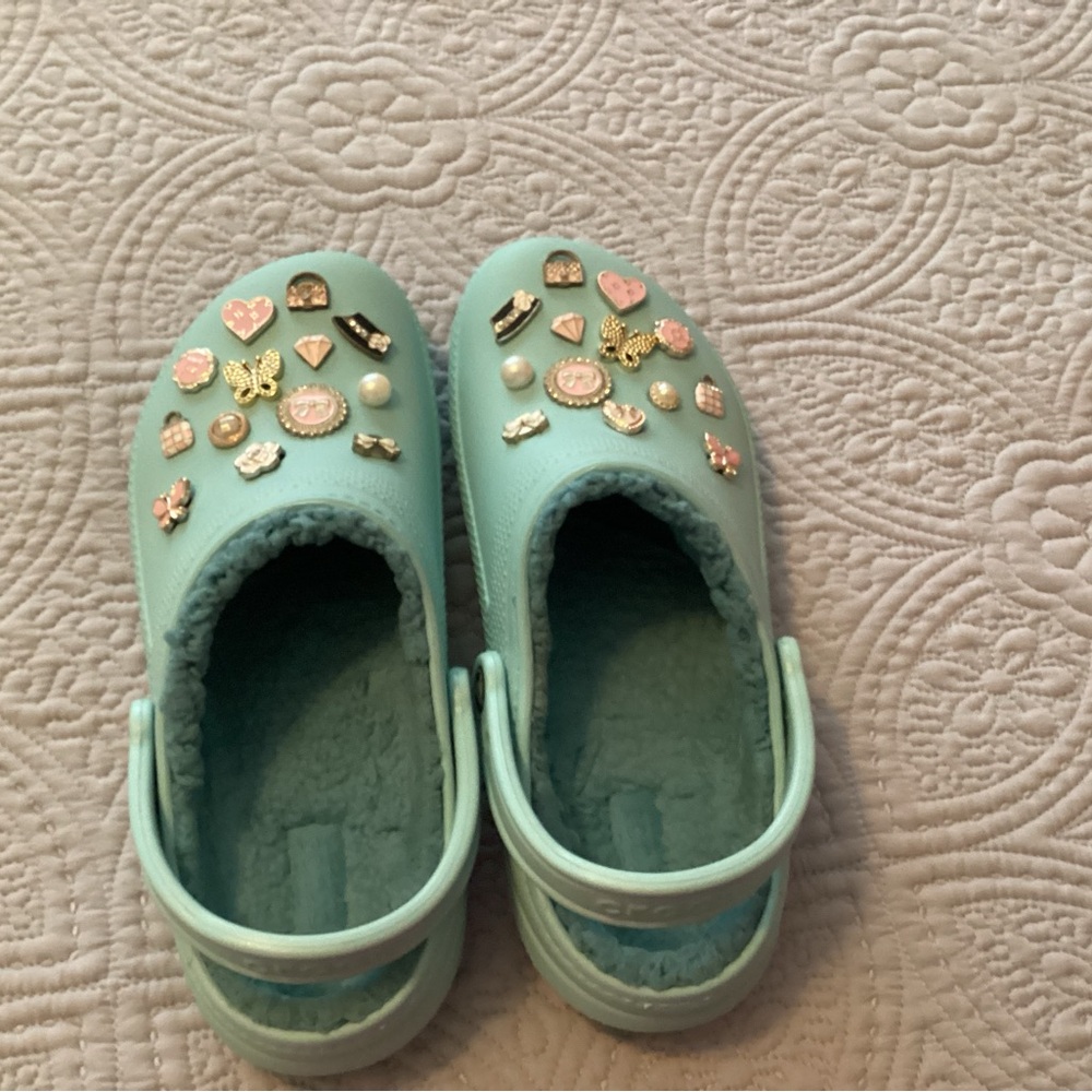 Womens Aqua CROCS with hand selected charms. NWOT. Smoke and pet free home.